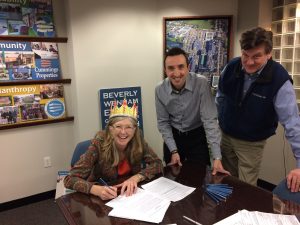Martha Farmer, Justin D'Avita and Dave Harriss at lease signing